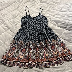 Multi color dress. Adjustable straps. Stretchy top. A-line skirt.